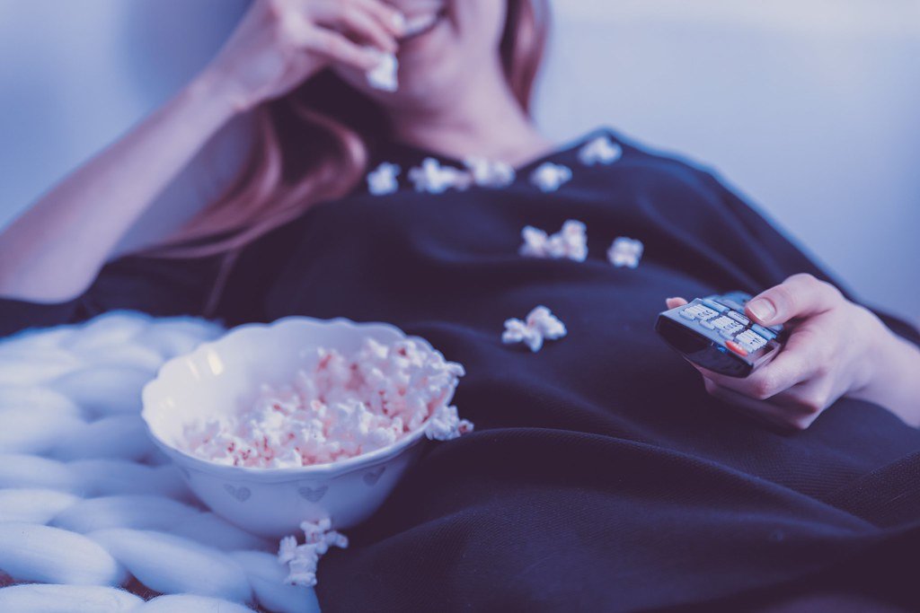 Movie night at home with popcorn — the best IPTV service experience